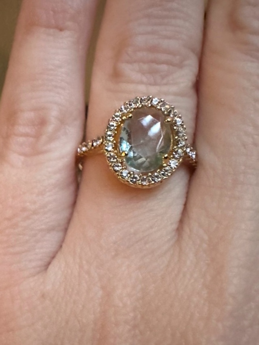 Green clear stone w/ CZ halo in yellow gold plated setting sz7